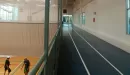 Thumbnail: Three-lane indoor track that runs overhead gym. 