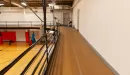 Thumbnail: Indoor track running above gymnasium. Two-person wide path around the perimeter of gym