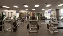 Thumbnail: Weights area with free weights, benches and squat racks. Mirrors on two walls.