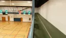 Thumbnail: Two-lane indoor track overhead of gymnasium. Track runs around perimeter of gym.