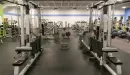 Thumbnail: Weights area with bars, benches, and functional training equipment.