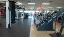 Thumbnail: Fitness equipment including Jacob's ladder, ellipticals, and functional training pieces.