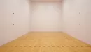 Thumbnail: Racquetball court. Rectangular room with wood flooring and regulation lines on floor.