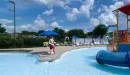Thumbnail: Outdoor pool showing children's play area and small slide.