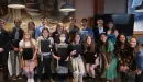 Thumbnail: College students at the Washington University Campus YMCA receive awards.