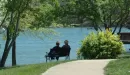 Thumbnail: sitting on a bench by lake in spring