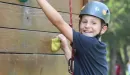 Thumbnail: boy on climbing wall