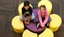 Thumbnail: Two students sitting on a flower chair