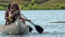 Thumbnail: two young women on the lake in a canoe