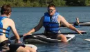 Thumbnail: two young men on paddle boards