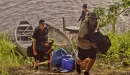 Thumbnail: campers unloading their gear as they prepare for a campout in a cove