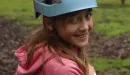 Thumbnail: girl in helmet preparing to climb tower