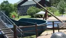 Thumbnail: View of water slide and beach with lodge in the background