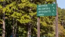 Thumbnail: a sign pointing to boathouse, ranch etc.