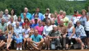 Thumbnail: A large group gathers on the deck for a photo