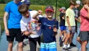 Thumbnail: ymca camp lakewood boy fishing with a fish he caught