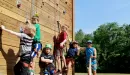 Thumbnail: ymca camp lakewood boys climbing on the rock-wall climbing tower