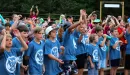 Thumbnail: ymca camp lakewood closing ceremony group of campers cheering
