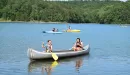 Thumbnail: ymca camp lakewood girls in canoe on sunnen lake