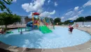 Thumbnail: kids play structure at the carondelet park rec complex outdoor aquatic center