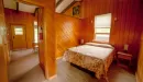 Thumbnail: YMCA Trout Lodge Bluff View Cabins Bedroom with Queen Bed