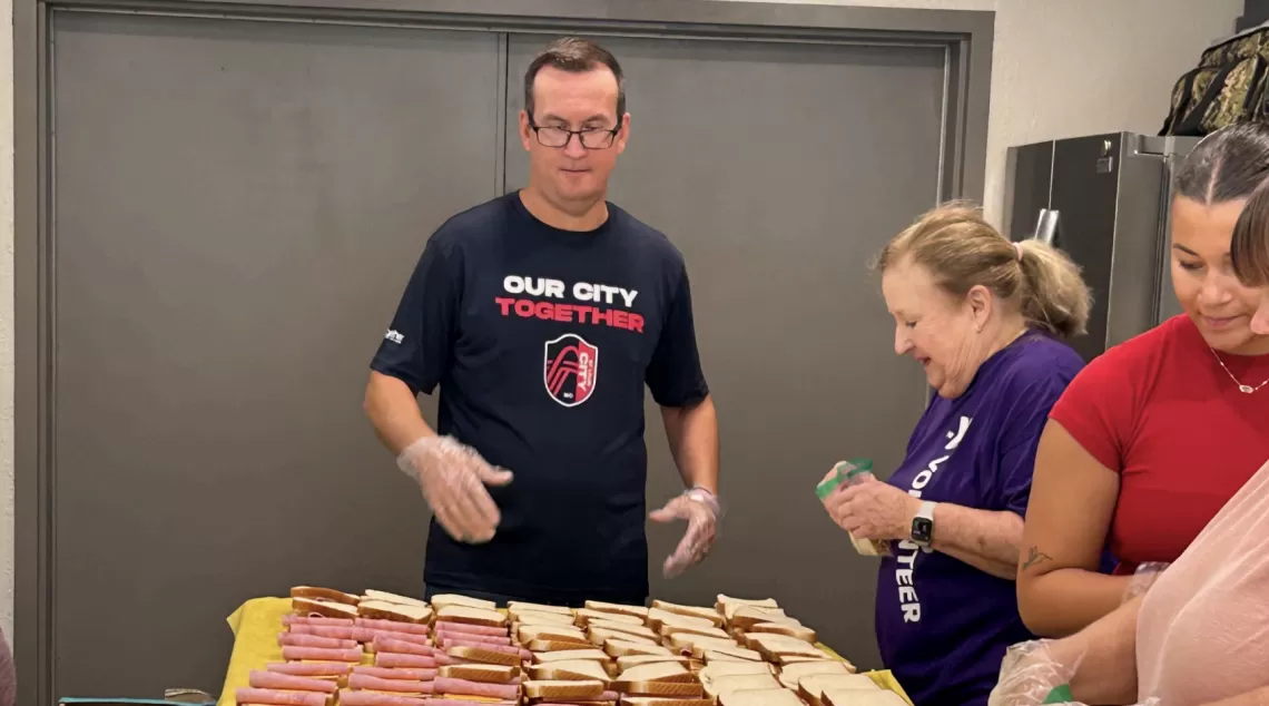 ymca staff preparing meals for Feed My Lambs