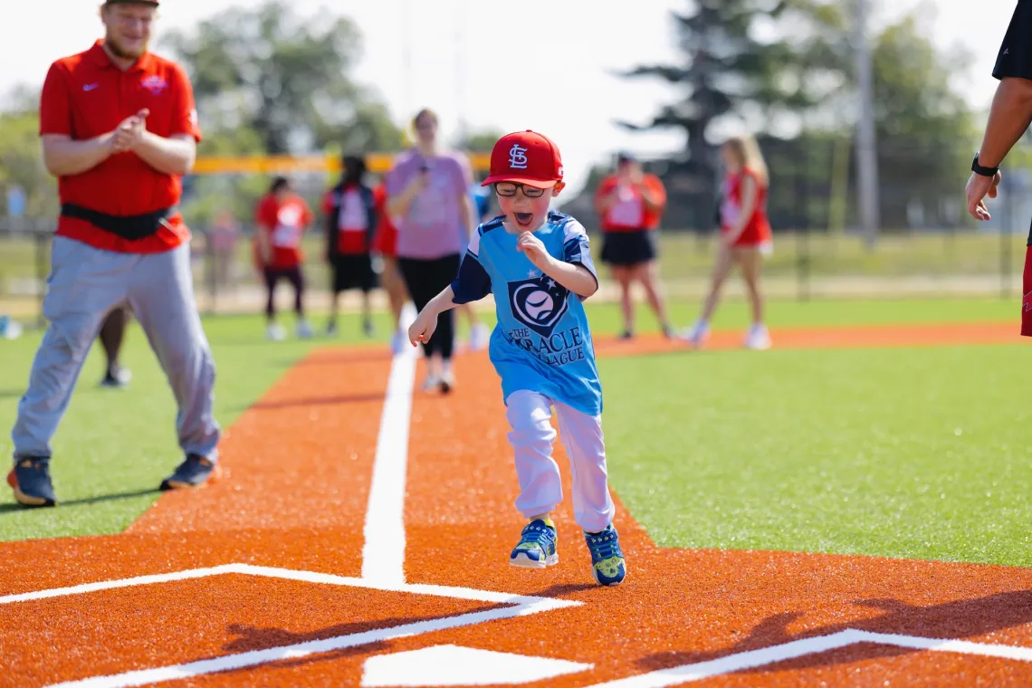 YMCA Adaptive Sports Complex Boy Scoring at Home Base