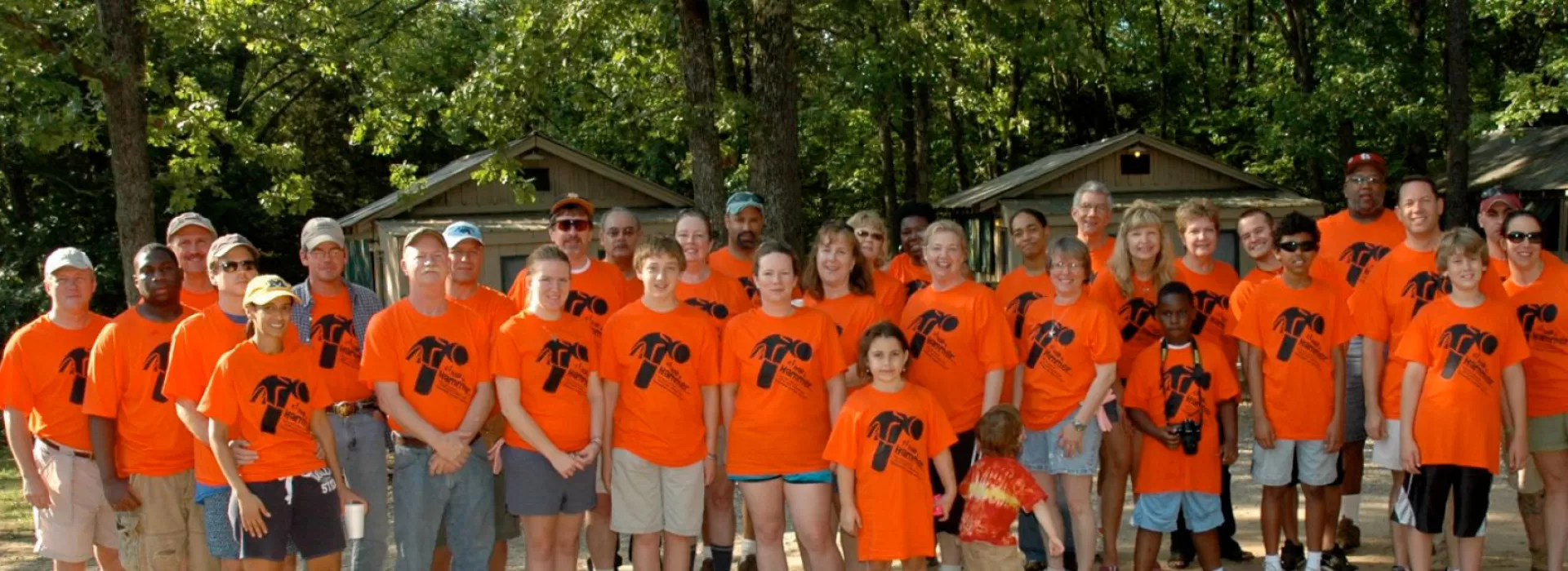 Alums in orange shirts
