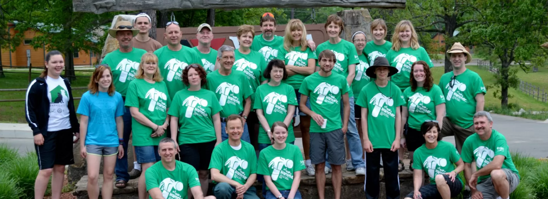 Alum group in green shirts