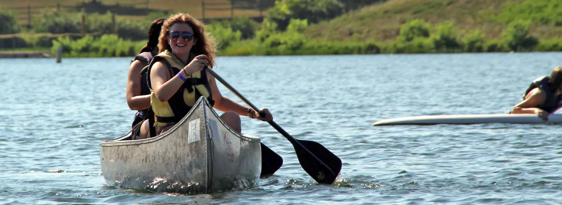 two young women on the lake in a canoe