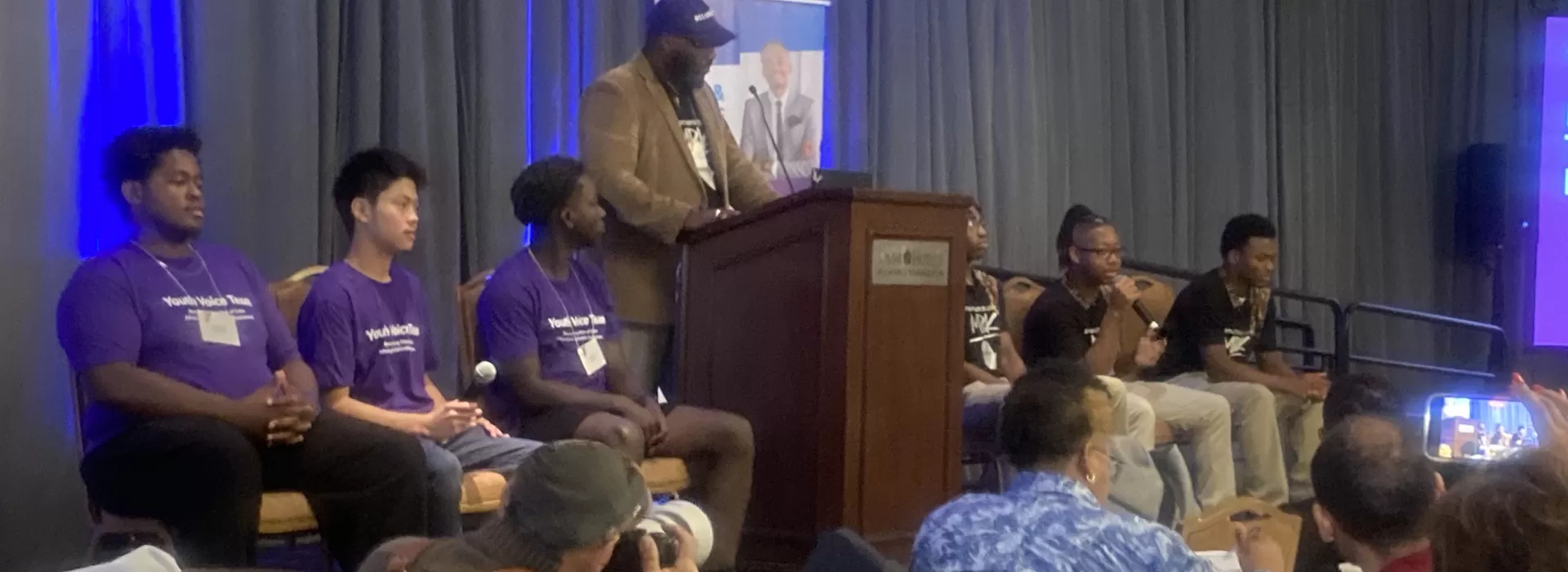 boys in BYMOC at an event panel