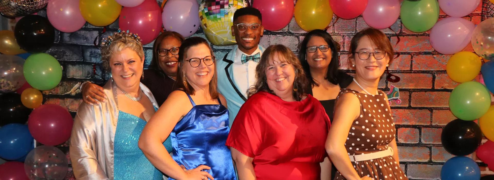 group posing at throwback prom