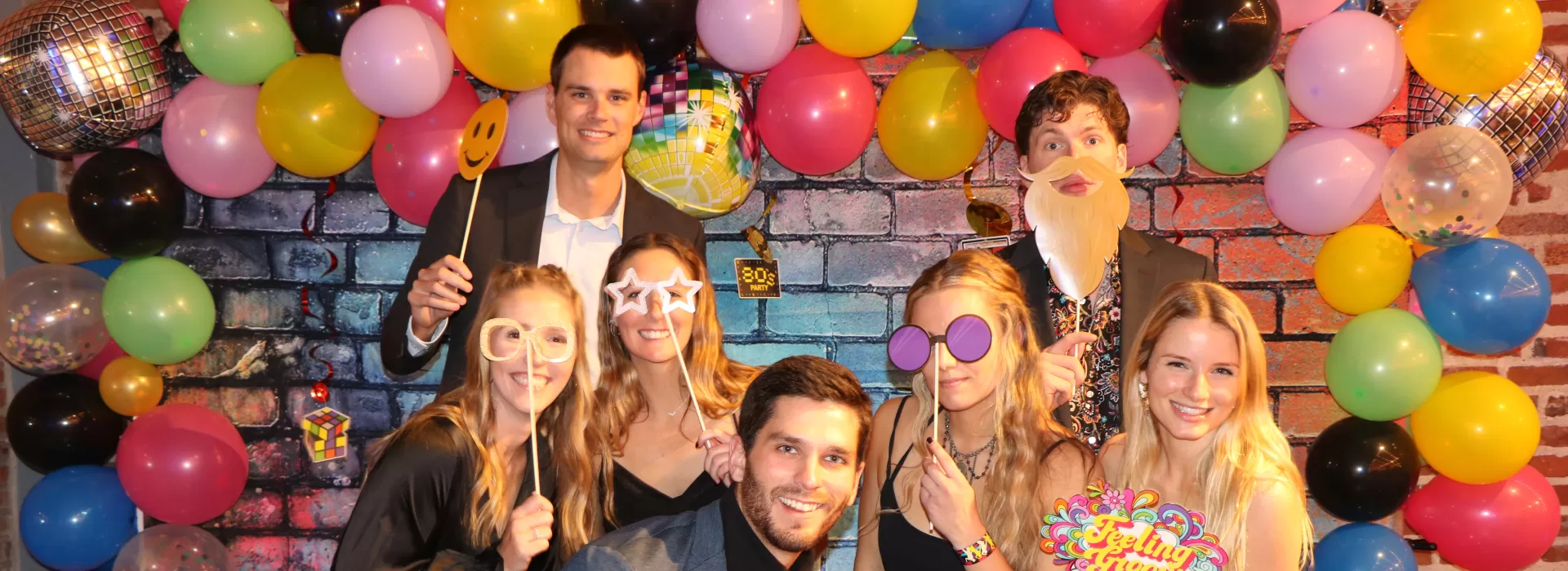 students posing at throwback prom