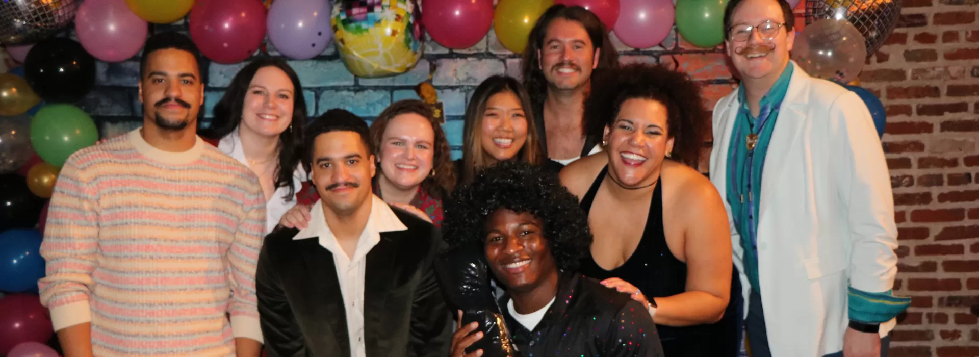 group posing at the throwback prom