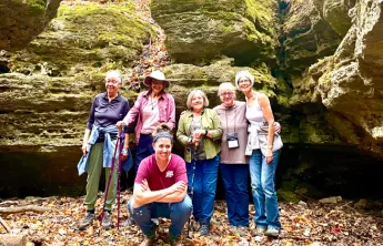women posing for photo outdoors at women's wellness weekend in ymca trout lodge