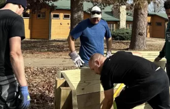 people building gaga pit at ymca camp lakewood