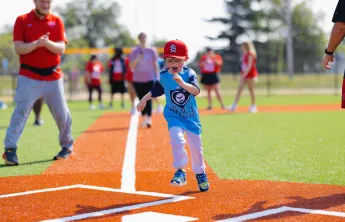 YMCA Adaptive Sports Complex Boy Scoring at Home Base
