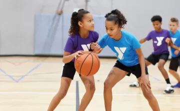 ymca youth basketball girls dribbling a ball
