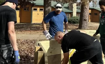 people building gaga pit at ymca camp lakewood